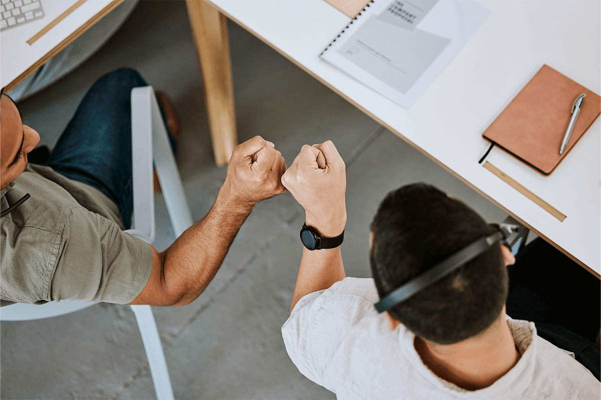 fist bumping between colleagues